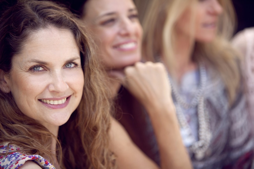 Happy group of adult women having fun