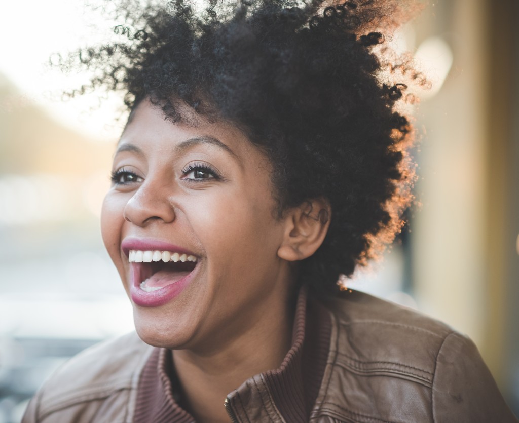 beautiful black curly hair african woman in town