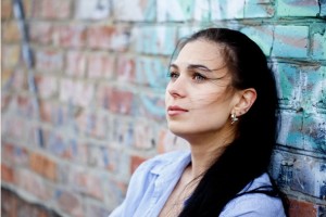 body-embraced-woman-brick-wall